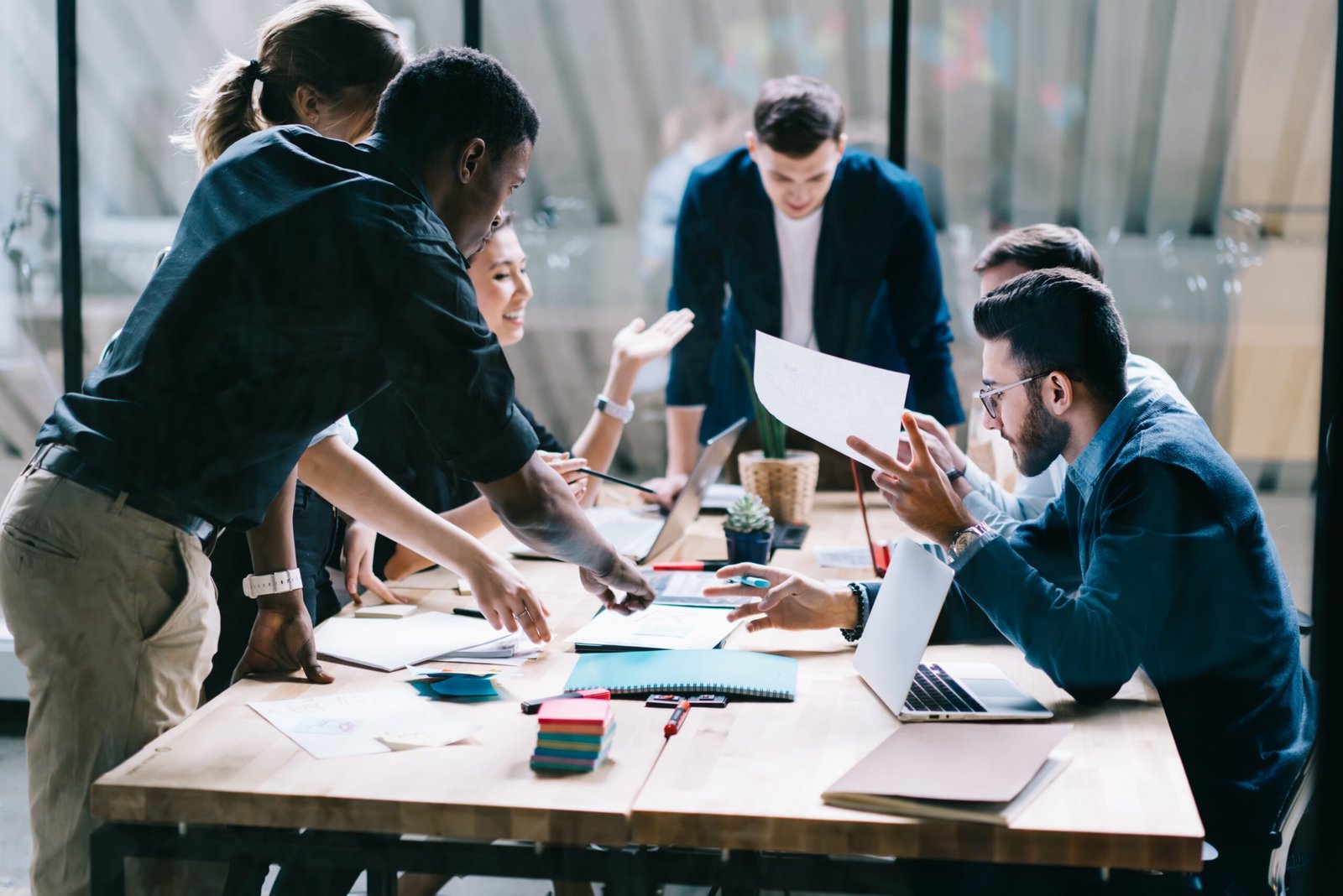 A hiring team reviewing candidate progress together